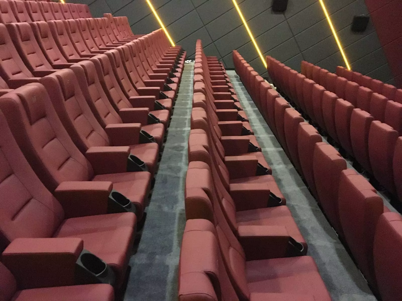 Durable cine seats with flame-retardant fabric for safety Image